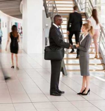 businessman-and-woman-shaking-hands-in-a-modern-bu-2021-08-26-16-13-55-utc (1) (1)